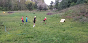 Campers playing Hunnyball on grass